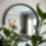 Elegant Reflection of Style Elegant circular mirror with a black frame reflecting an interior space.