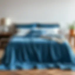 Elegant blue bedspread draped over a modern bed frame