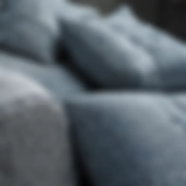 Close-up of textured fabric on blue and gray cushions