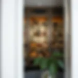 A sophisticated liquor cabinet showcasing glass shelves with bottles elegantly displayed.