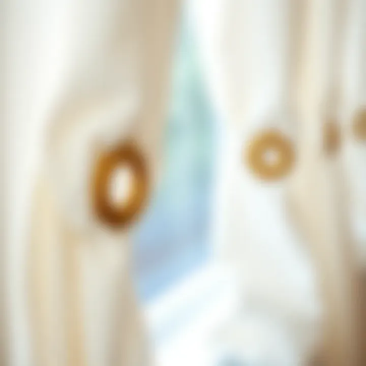 Close-up of grommet detailing on white linen curtains showcasing craftsmanship