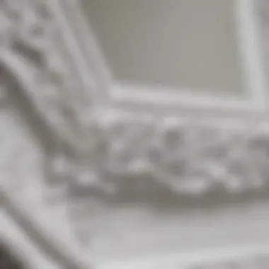 Close-up view of the intricate frame details of a white framed mirror