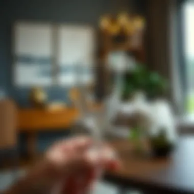 Timeless Aesthetic in Contemporary Environments A vintage Anchor Hocking glass being admired against a modern backdrop